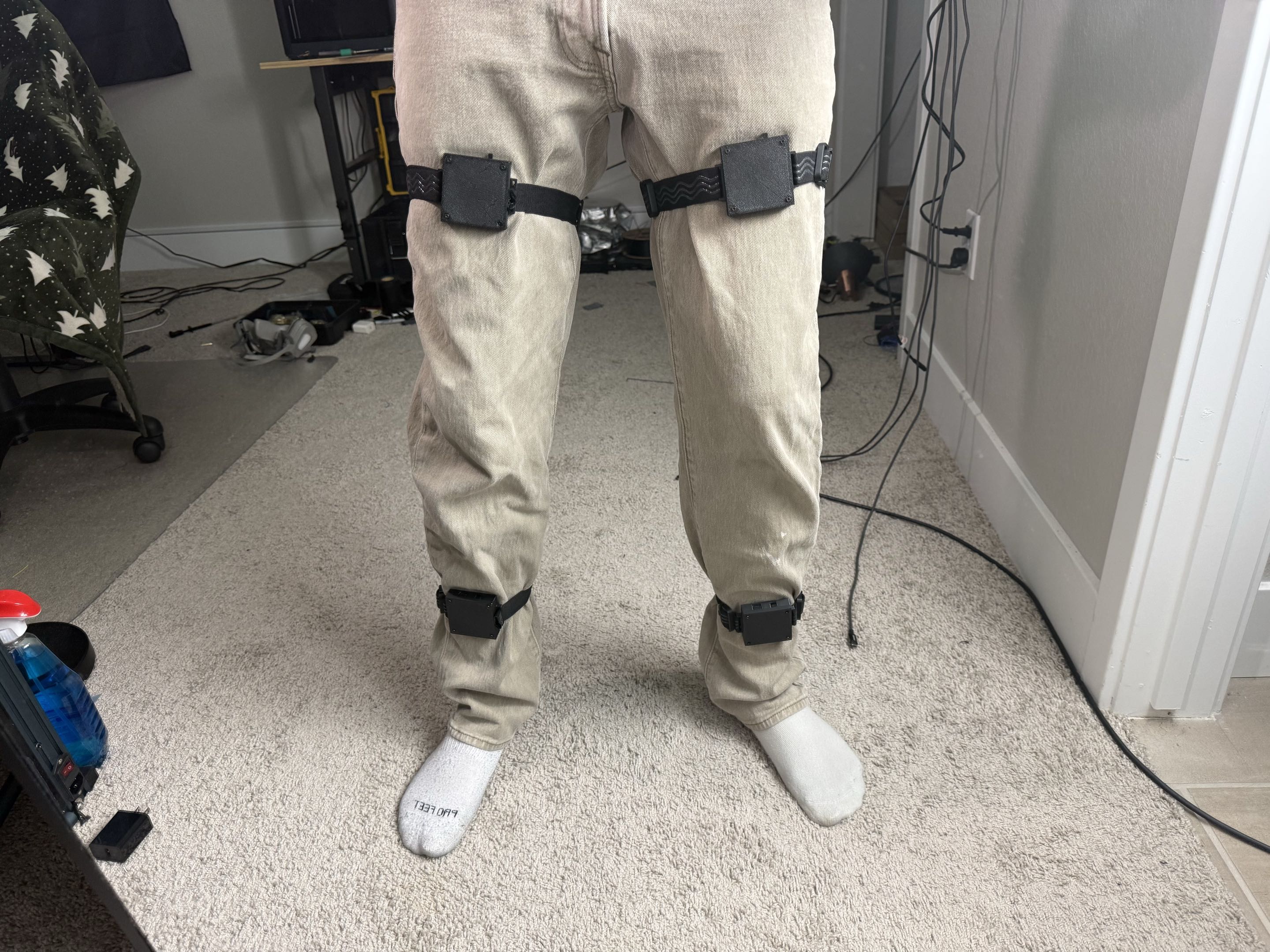 Four DIY SlimeVR trackers mounted on both thighs and ankles